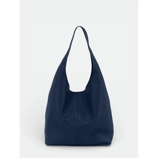 Sac porté épaule bleu avec anse large intégrée, vu de face sur fond clair