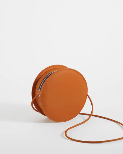 Mini sac rond orange en cuir végétal artisanal – Bmassy