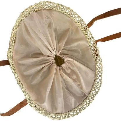 Panier capazo en raphia beige vu du dessus, avec sa poche en tissu resserrée