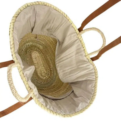 Intérieur du panier capazo Bmassy en raphia beige, avec tissu beige et fond tressé