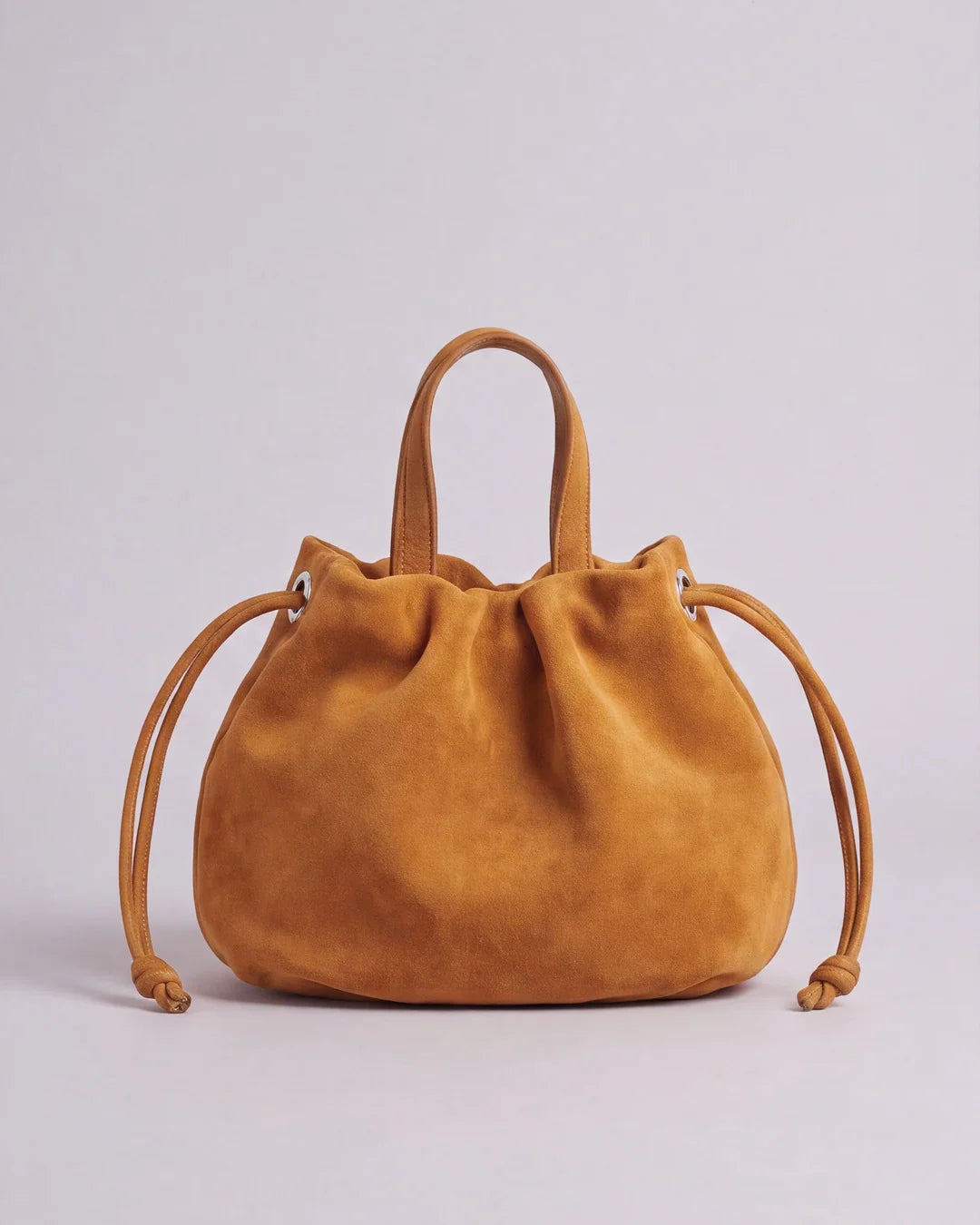 Petit sac à main Angelines en cuir à l’aspect suédé jaune moutarde vu de face, Bmassy.