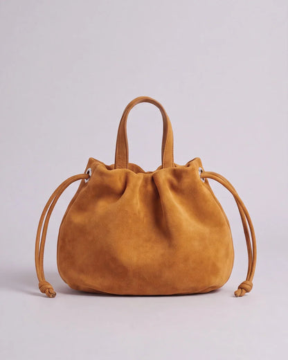 Petit sac à main Angelines en cuir à l’aspect suédé jaune moutarde vu de face, Bmassy.