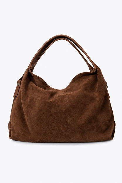 Sac à main Capucine en cuir velours marron, vu de face sur fond clair, avec ses deux anses