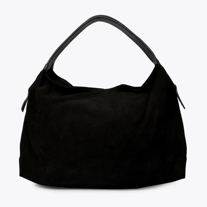 Sac à main Capucine en cuir velours noir, vu de face sur fond clair, avec ses deux anses